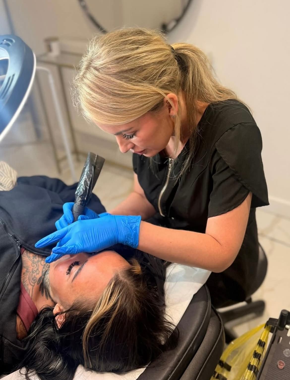 Natalie treating a client in her private studio